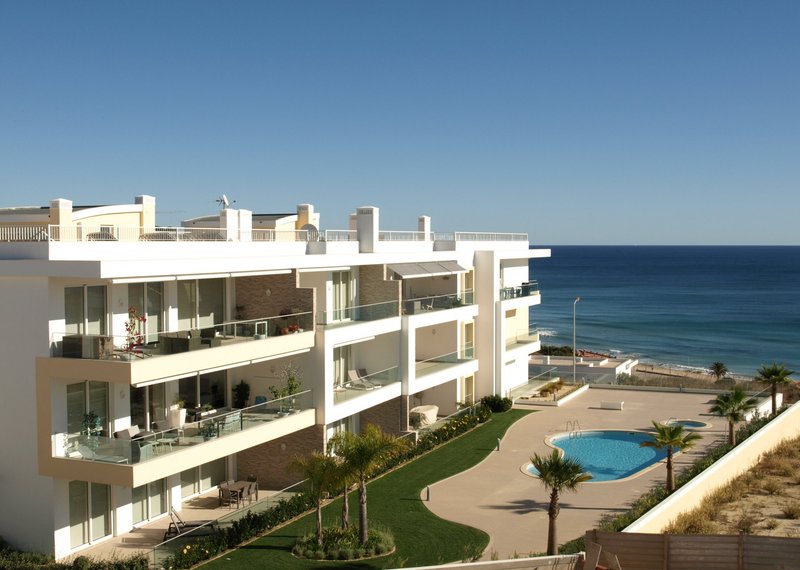 Apartment building with garden and pool